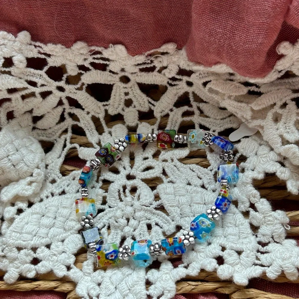 Millefiori glass beaded bracelet with silver‎ flower accents